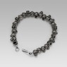 Oz Abstract Tokyo silver skulls Crocodile Hunter bracelet front view.