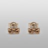 Gold skull pierces.